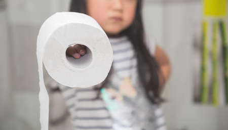 A large white toilet paper roll for use in bathrooms or kitchens, used for cleaning dirt in the bathroom background.の写真素材