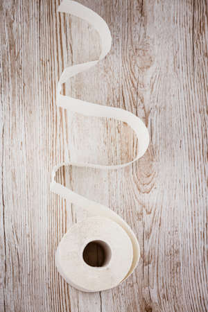 A large white toilet paper roll for use in bathrooms or kitchens, used for cleaning dirt in the bathroom background.の写真素材