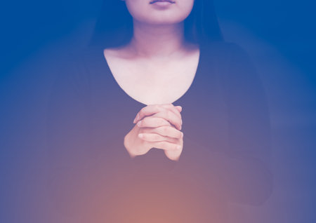 woman praying and worship to GOD Using hands to pray in religious beliefs and worship christian in...