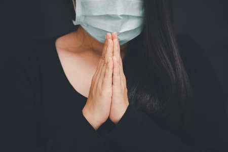 woman praying and worship to GOD Using hands to pray in religious beliefs and worship christian in the church or in general locations in vintage color tone or copy space.の写真素材
