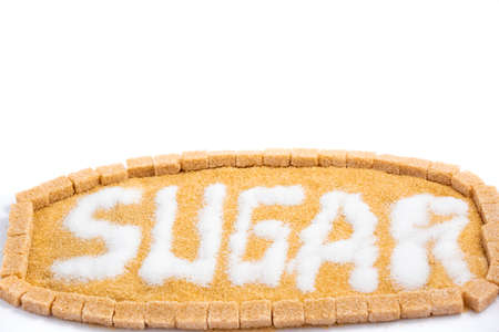 Brown sugar in a wooden bowl or wooden spoon Sugar for health Use for cooking or desserts on white and sugar backgrounds.の写真素材