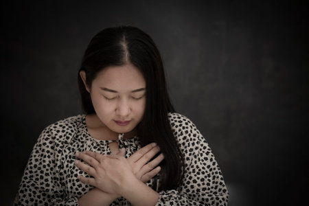 Asian Woman praying and worship to GOD Using hands to pray in religious beliefs and worship...