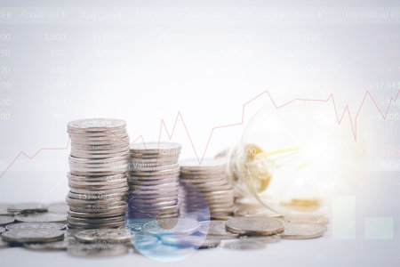 Coins stack and the light bulb with line graph  business connect on white background, Saving  ideas...