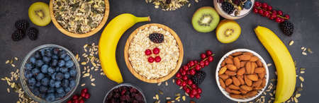 Group Fruits Breakfast with bread Whole grains and nuts, yogurt mix with Cherry , banana, avocado in the wooden table. Breakfast for Health and Diet conceptの写真素材
