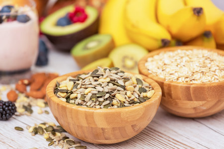 Group Fruits Breakfast with bread Whole grains and nuts, yogurt mix with Cherry , banana, avocado in the wooden table. Breakfast for Health and Diet conceptの写真素材
