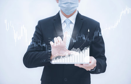 Businessman holding tablet bar graph of analytics and financial, Changes in new planning, Business...