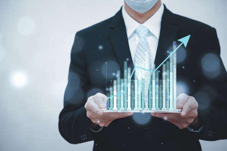 Businessman touchscreen  number 2021 year in the graph on the Fireworks background ,Business idea new year concept. copy space.の写真素材