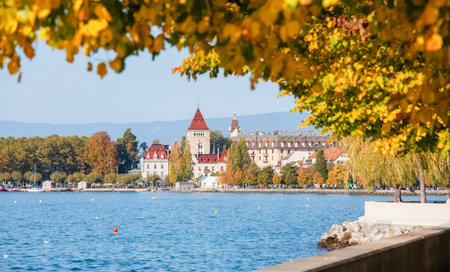 View lake  Chateau dOuchy , in the spring, on a clear day, with flies and clouds in Lake Lausanne, Switzerland.のeditorial素材