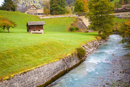 Natural scenery, trees, mountains, sky and clouds In the lake, there is a shadow reflecting the water in the lake. Beauty in Europe during the cold and tourism during the holidays.のeditorial素材