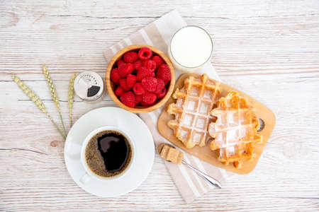 Breakfast in the morning with black coffee cup with bread with Croissant and fruit on the wooden table.の写真素材