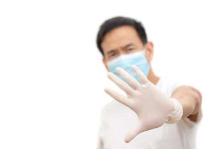 The image face  of a young Asian man wearing a mask to prevent germs, toxic fumes, and dust....