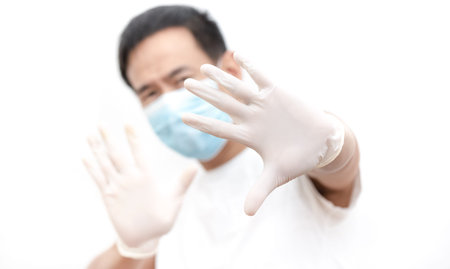 The image face  of a young Asian man wearing a mask to prevent germs, toxic fumes, and dust....