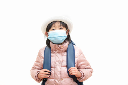 The image face of a Children Wearing a mask with Family to prevent germs, toxic fumes, and dust....