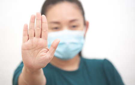 The image face of a young Asian woman wearing a mask to prevent germs, toxic fumes, and dust....