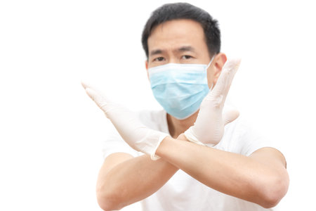 The image face  of a young Asian man wearing a mask to prevent germs, toxic fumes, and dust....