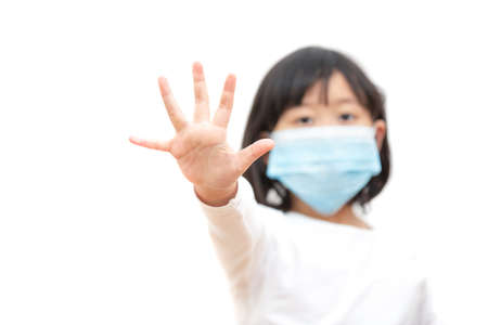 The image face of a Children Wearing a mask with Family to prevent germs, toxic fumes, and dust. Prevention of bacterial infection coronavirus in the air in a white backgroundの写真素材