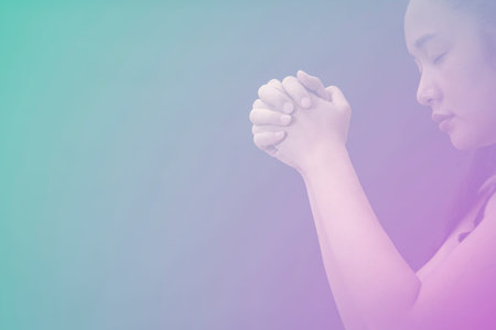 Woman's hand praying and worship to GOD Using hands to pray in religious beliefs and worship...