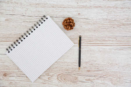 White note book and accessories and office stuff On Wooden Desk With Stationary Objects , Top View,Travel concept.copy space for text or designの写真素材