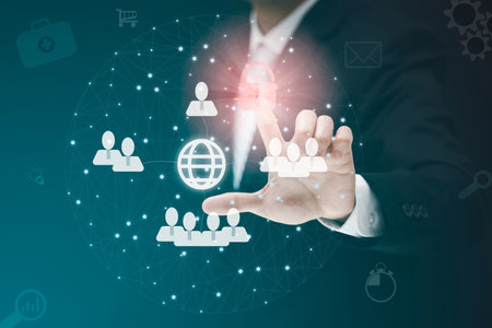 Businessman holding HR Human ,people icon on the graph Screen of a media screen, Technology Process...