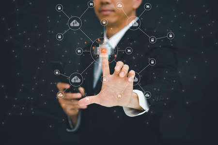 Businessman touching Big data Cloud and business intelligence with chart and graph icons, Team success, HR Human, Business success, and teamwork concept.の写真素材