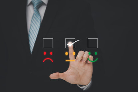 Businessman people are touching the virtual screen on the happy and unhappy Smile face icon in...