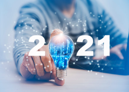 New Target business and 2021 light bulb concept, Business holding light bulb, innovative idea of ââinspiration from online technology, Changes in new planning, Business growth, ideas and perspectives.の写真素材