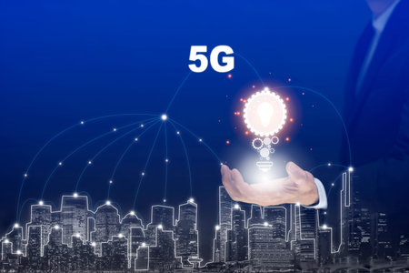 Business holding light bulb technology 5G of mobile telecommunication network in Europe for high...