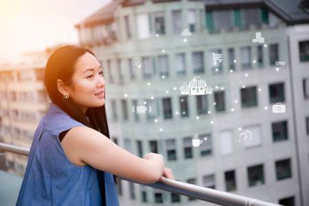 Beautiful Asian women are thinking about shopping online and are happy to shop or shop with Technology Process System icons.の写真素材