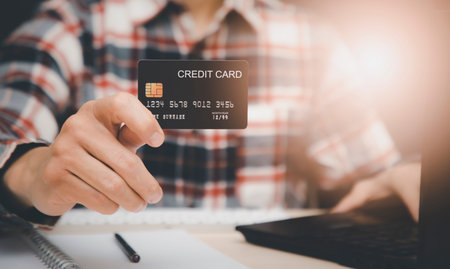 Businessman holding credit card and using laptop computer. Online shopping concept,banking and...