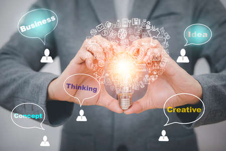 thinking and creative concept, Close up light bulb and working on the desk, Creativity and innovation are keys to success.Concept of new idea and innovation with Brain and light bulbs, working at homeの写真素材