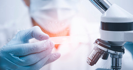 biochemical research scientist working with microscope for coronavirus, laboratory glassware...