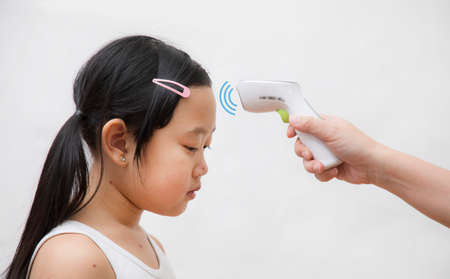 Close-up of Temperature meter  and naked body Chickenpox disease, Little girl ill with chickenpox on white background. Chickenpox virus, chickenpox outbreak in children. Concept of contagion.の写真素材