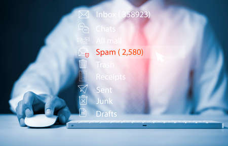 Email concept with laptop spam and virus computer monitor internet security concept, businessman reading electronic mail with a laptop. Spam, junk and e-marketing on-screen, Spam Email Pop-up Warning.の写真素材