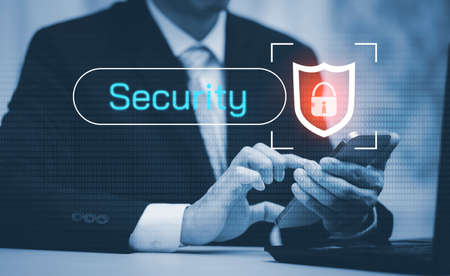 Businessman hand holding mobile phone, Digital Composite Image Of user Using Laptop With, cyber security concept, data protection and secure internet access, cybersecurity online technology.の写真素材