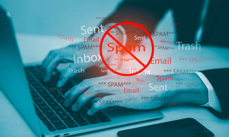 Email concept with laptop spam and virus computer monitor internet security concept, businessman reading electronic mail with a laptop. Spam, junk and e-marketing on-screen, Spam Email Pop-up Warning.の写真素材