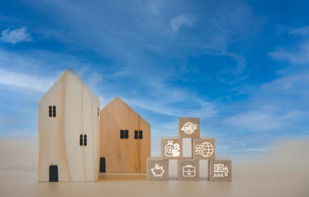 Mini wood house model from model on wood table with icon, Planning buy Real Estate, Planning to buy property and Choose the best. work from home and stay at home concept.の写真素材