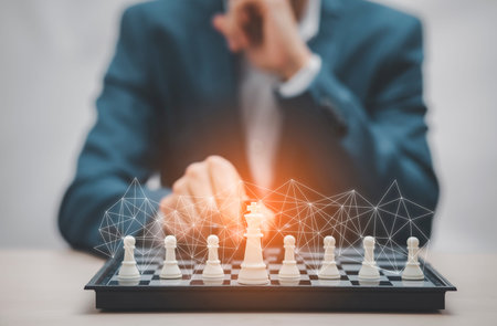 Planning and Decision concept, Businessman with strategy competitive ideas concept with chess board game. Business competition, Fighting and confronting problems, threats from surrounding problems.の写真素材