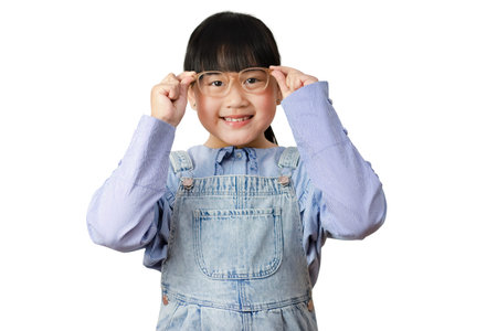 Happy Asian little girl wears glasses smiling and fun isolated over in the white background, Copy...