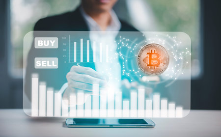 Digital graph with Bitcoin chart on-screen among piles of Bitcoin concept. businessman touch on  BUY and SELL buttons. Bitcoin on the stock market, Cryptocurrency, and finance.の写真素材