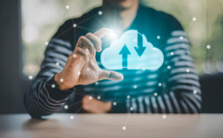 Business holding cloud networking concept and touch screen with hand connection line on the black background, Cloud computing is a system for sharing download and upload big data information, conceptの写真素材