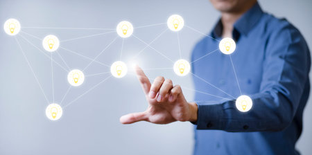 Businessman touchscreen on the light bulb icon graph Screen Icon of a media screen, Technology...