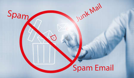 Email concept with laptop spam and virus computer monitor internet security concept, businessman reading electronic mail with a laptop. Spam, junk and e-marketing on-screen, Spam Email Pop-up Warning.の写真素材