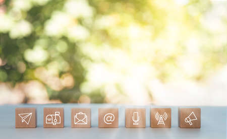communication and technology concept , wooden block cube symbol telephone, email, address. Website page contact us or e-mail marketing on the nature background , Contact us in customer support conceptの写真素材