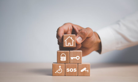 Wooden blocks with icons of various types of insurance, icons healthcare medical symbol on wooden...