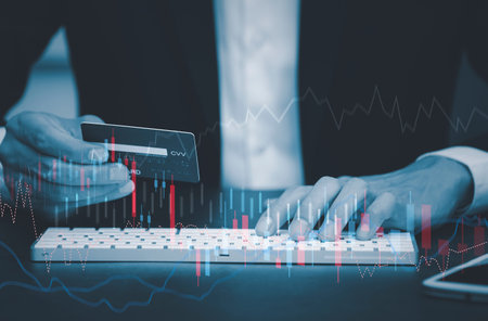 Businessman touchscreen line of Stock market or forex trading graph and candlestick chart suitable...