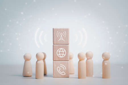 communication and technology concept , Hand putting wooden block cube symbol telephone, email, address. Website page contact us or e-mail marketing, Contact us in customer support conceptの写真素材