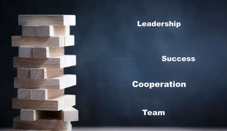 Blocks wood game with text business copy space, The tower from wooden blocks from the top view, Businessman manage his strategy, Concept of education, risk, development, and growthの写真素材