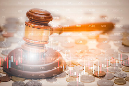 Old wood Judge hammer with stacking coins in close-up and coins stack the table wood background,...