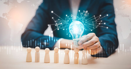 thinking and creative, Businessman hand holding light bulb on the wooden people, Teamwork and idea...