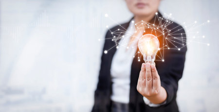 Concept creativity with light bulbs and energy power, Woman hand holding light bulbs, ideas of new...